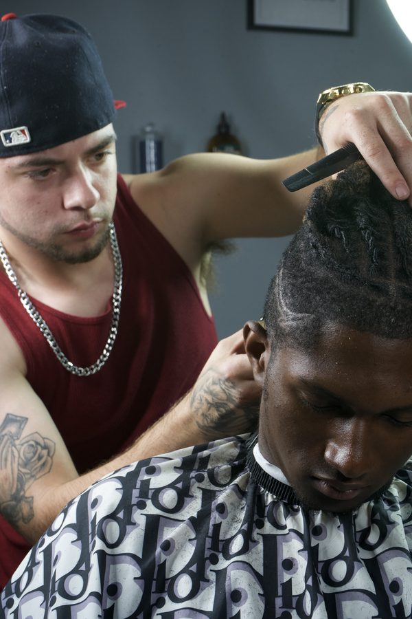 Shaun Fade cutting hair in the shop